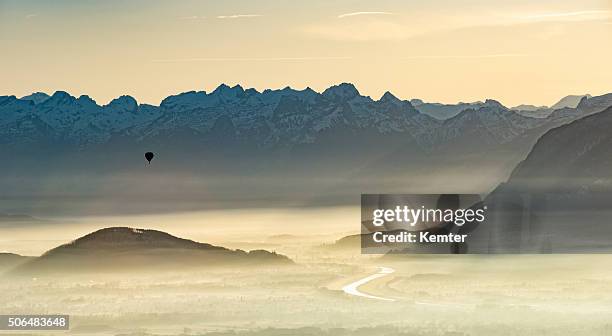 balloon over foggy borderland between austria and switzerland - vorarlberg stock pictures, royalty-free photos & images