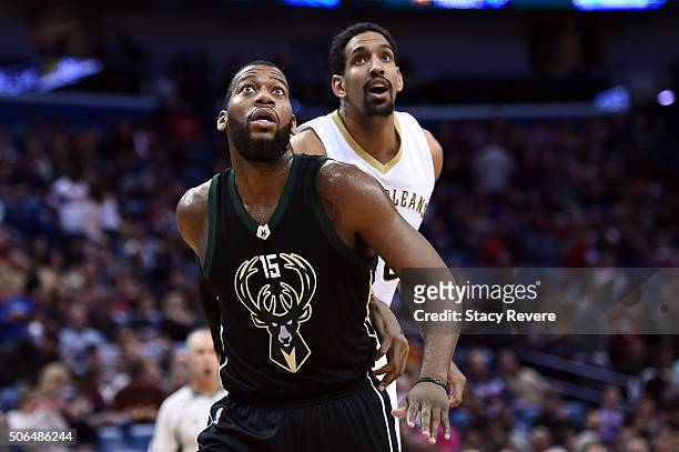 Greg Monroe of the Milwaukee Bucks works against Alexis Ajinca of the New Orleans Pelicans during the first half of a game at the Smoothie King...