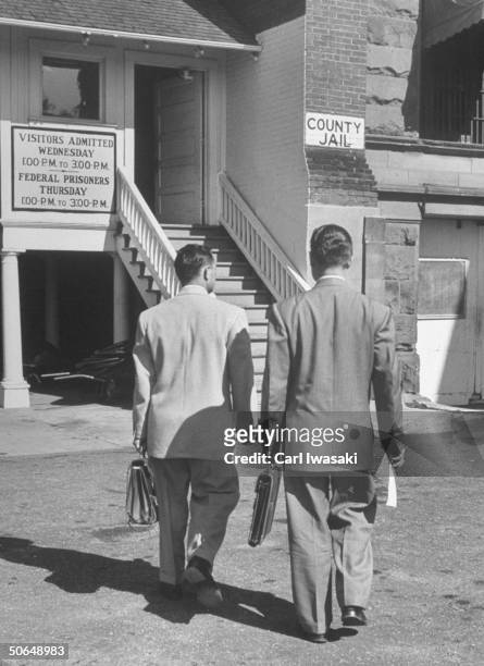 Denver University law students Donald Gallion and Harry Anderson walking towards the county jail.