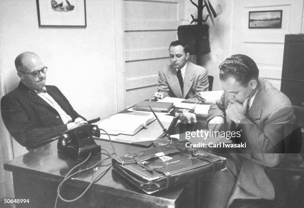 Denver University law students Harry Anderson and Donald Gallion conferring with their law professor Vance Dittman Jr. .