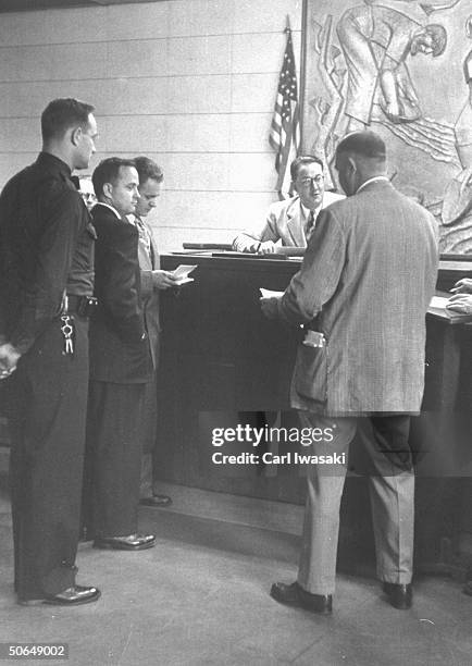 Denver University law students Harry Anderson and Donald Gallion standing in court.