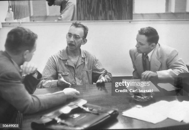 Denver University law students Harry Anderson and Donald Gallion talking with Joseph Springer.