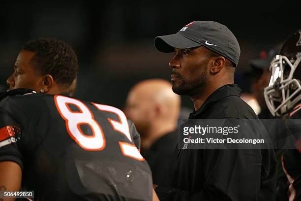 Running back coach Priest Holmes of the National Team looks on from the sideline during the NFLPA Collegiate Bowl between the American Team and the...