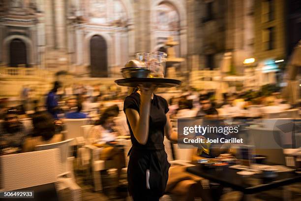 busy waitress in malaga, spain - waitress stock pictures, royalty-free photos & images