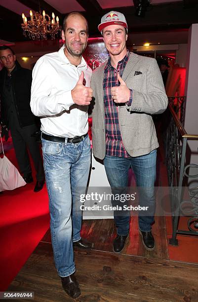 Skier Didier Defago and skier Erik Guay during the 'Hummer Party' at hotel 'Kitzhof' on January 23, 2016 in Kitzbuehel, Austria.
