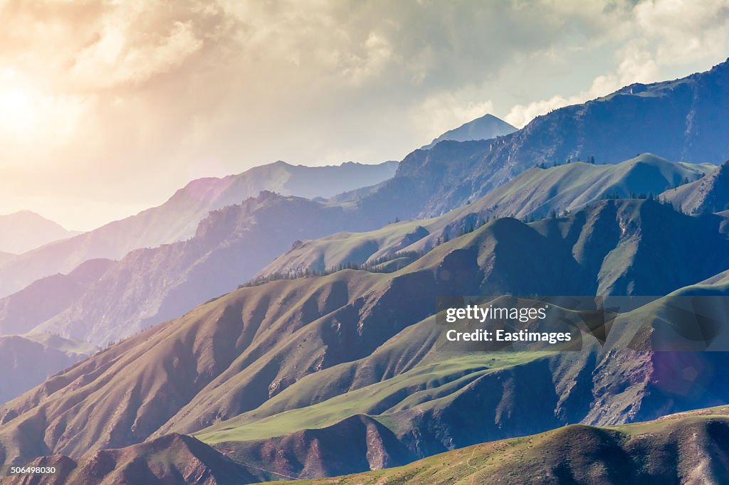Mountains under cloudy sky and sunshine/Qinghai,China.