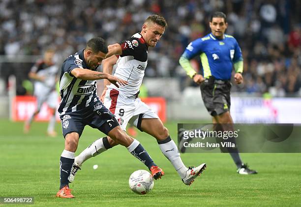 Walter Gargano of Monterrey fights for the ball with Gonzalo Bergessio of Atlas during the 3rd round match between Monterrey and Atlas as part of the...
