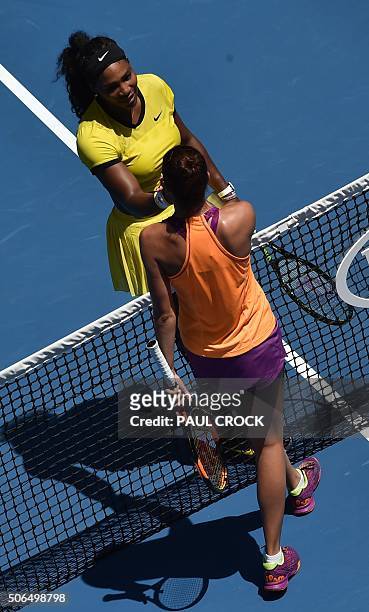 Serena Williams of the US shakes hands with Russia's Margarita Gasparyan following her win during their women's singles game on day seven of the 2015...
