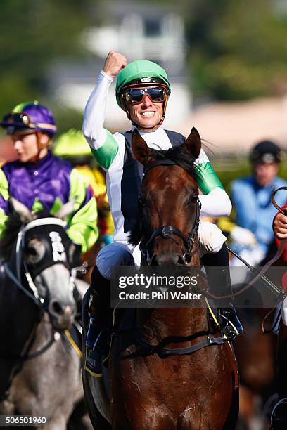 Michael McNab riding Raghu celebrates after winning the Karaka Three Year Old Mile at the Ellerslie Racecourse on January 24, 2016 in Auckland, New...