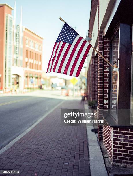 american flag downtown - fayetteville stock pictures, royalty-free photos & images