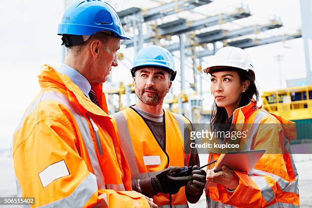 coordinating logistics - warehouse safety stock pictures, royalty-free photos & images