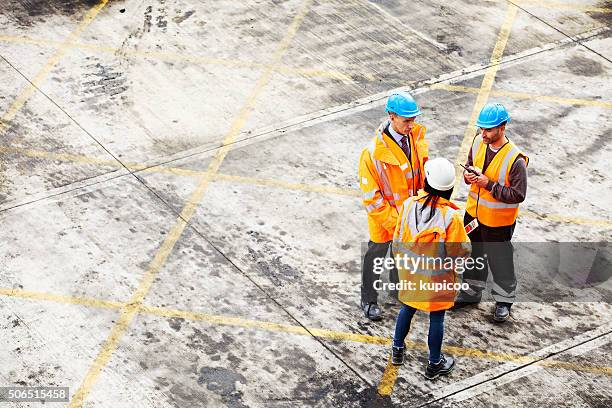 down on the shipyard floor... - warehouse safety stock pictures, royalty-free photos & images