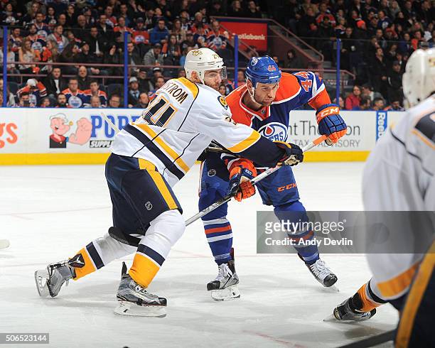 Zack Kassian of the Edmonton Oilers battles for the puck against Eric Nystrom of the Nashville Predators on January 23, 2016 at Rexall Place in...