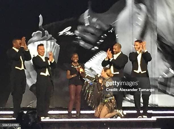 Madonna is seen singing "Happy Birthday" to her daughter Mercy James on stage during her Rebel Heart Tour at AmericanAirlines Arena on January 23,...