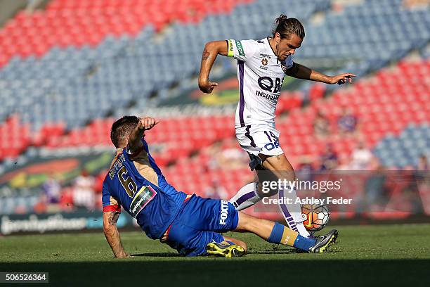 Joshua Risdon of the Glory is contested by Cameron Watson of the Jets during the round 16 A-League match between the Newcastle Jets and the Perth...