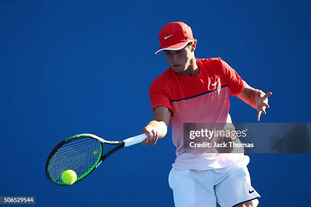 Oliver Anderson of Australia plays a forehand in his first round match against Lukas Klein of Slovakia during the Australian Open 2016 Junior...