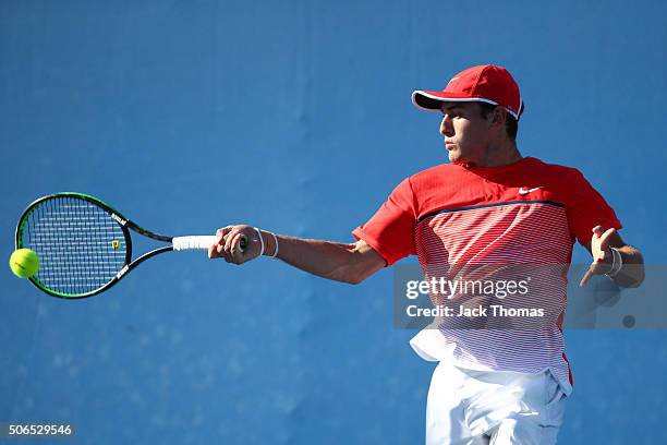 Oliver Anderson of Australia plays a forehand in his first round match against Lukas Klein of Slovakia during the Australian Open 2016 Junior...