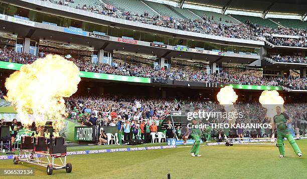 Marcus Stoinis of the Melbourne Stars and teammate Luke Wright enter the arena before the start of the T20 Big Bash League cricket final between the...