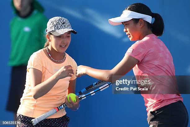 Naho Sato and Stako Sueno of Japan compete in their match against Alexandra Bozovic and Kaylah McPhee of Australia during the Australian Open 2016...