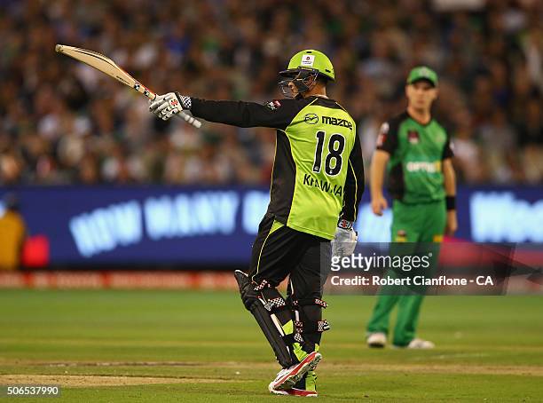Usman Khawaja of the Thunder celebrates after reaching his half century during the Big Bash League final match between Melbourne Stars and the Sydney...