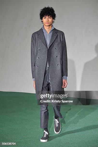 Model walks the runway during the Officine Generale Menswear Fall/Winter 2016-2017 show as part of Paris Fashion Week on January 24, 2016 in Paris,...