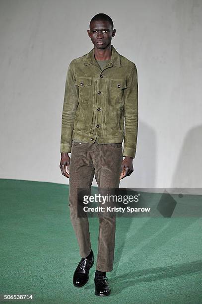 Model walks the runway during the Officine Generale Menswear Fall/Winter 2016-2017 show as part of Paris Fashion Week on January 24, 2016 in Paris,...