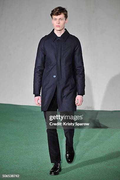 Model walks the runway during the Officine Generale Menswear Fall/Winter 2016-2017 show as part of Paris Fashion Week on January 24, 2016 in Paris,...