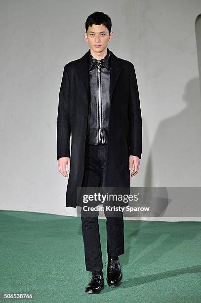 Model walks the runway during the Officine Generale Menswear Fall/Winter 2016-2017 show as part of Paris Fashion Week on January 24, 2016 in Paris,...