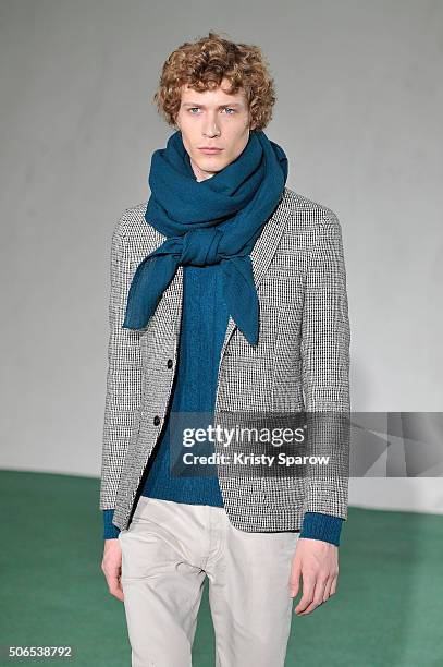 Model walks the runway during the Officine Generale Menswear Fall/Winter 2016-2017 show as part of Paris Fashion Week on January 24, 2016 in Paris,...