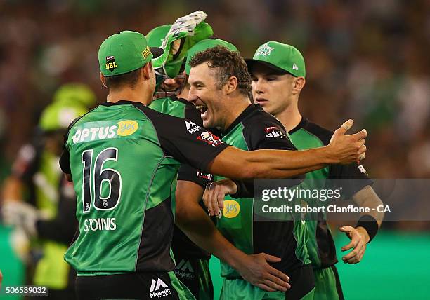 David Hussey of the Stars celebrates with team mates after taking the wicket of Usman Khawaja of the Thunder during the Big Bash League final match...