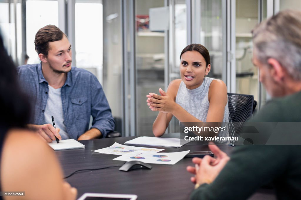 Aboriginal business woman talking in a meeting