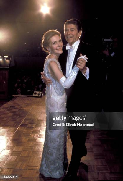 Newly-elected President Ronald Reagan ballroom dancing with wife Nancy during his inaugural ball.
