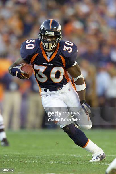 Terrell Davis of the Denver Broncos heads downfield against the San Diego Chargers during the game at Invesco Field at Mile High Stadium in Denver,...