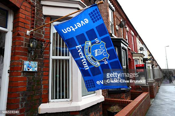 An Everton flag and house sign adorn a home in Gwladys Street next to the stadium before the Barclays Premier League match between Everton and...