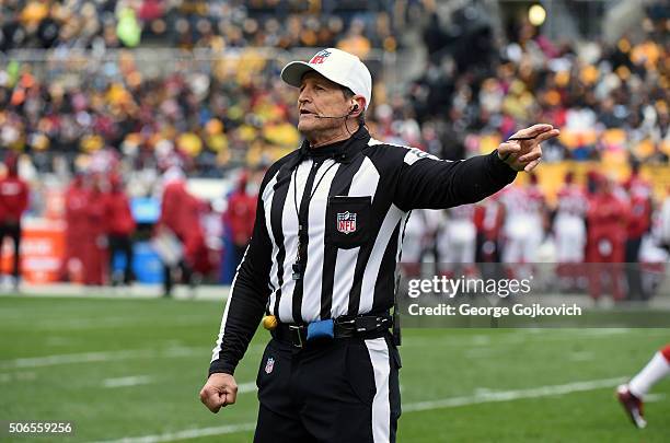 National Football League referee Ed Hochuli signals during a game between the Arizona Cardinals and Pittsburgh Steelers at Heinz Field on October 18,...