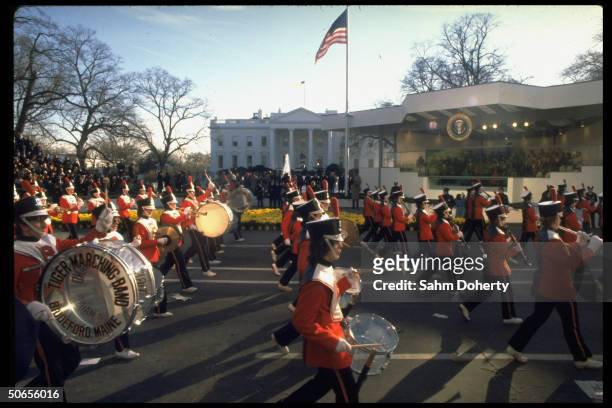 Marching band participating in Presidential Inaugural Parade passing the reviewing stand.