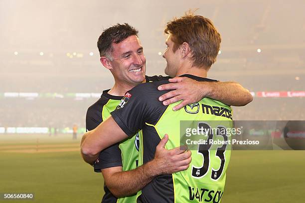 Michael Hussey of the Thunder celebrates with team-mate Shane Watson of the Thunder after a win during the Big Bash League final match between...
