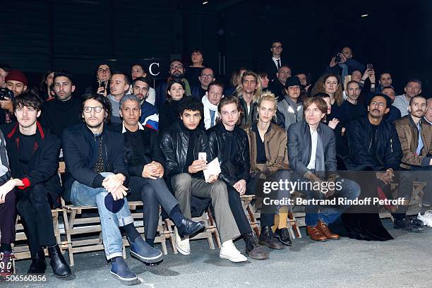 Actors Cesar Domboy, Felix de Givry, Sami Bouajila, Guest, Lucas Ionesco, Aymeline Valade, Nicolas Godin and Haider Ackermann attend the Lanvin...