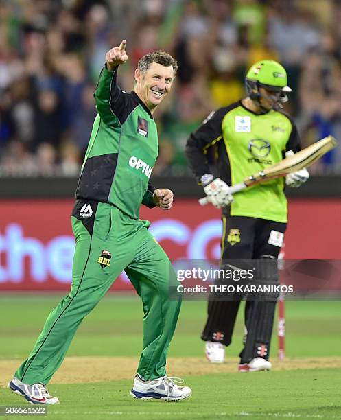 Melbourne Stars cricker David Hussey celebrates after taking the wicket of Sydney Thunder's Usman Khawaja during the T20 Big Bash League cricket...