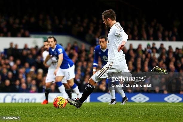 Gylfi Sigurdsson of Swansea City scores the opening goal from the penalty spot during the Barclays Premier League match between Everton and Swansea...