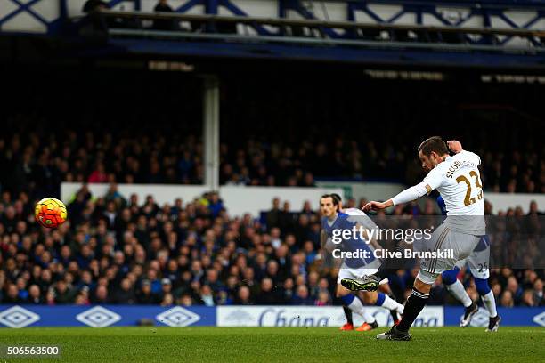 Gylfi Sigurdsson of Swansea City scores the opening goal from the penalty spot during the Barclays Premier League match between Everton and Swansea...