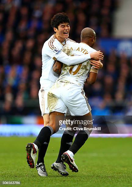 Andre Ayew of Swansea City celebrates with team-mate Ki Sung-Yeung after scoring his team's second goal during the Barclays Premier League match...