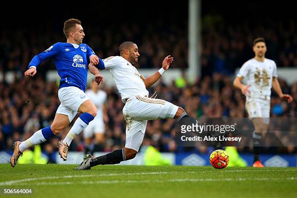 Ashley Williams of Swansea City stretches for the ball ahead of Gerard Deulofeu of Everton during the Barclays Premier League match between Everton...