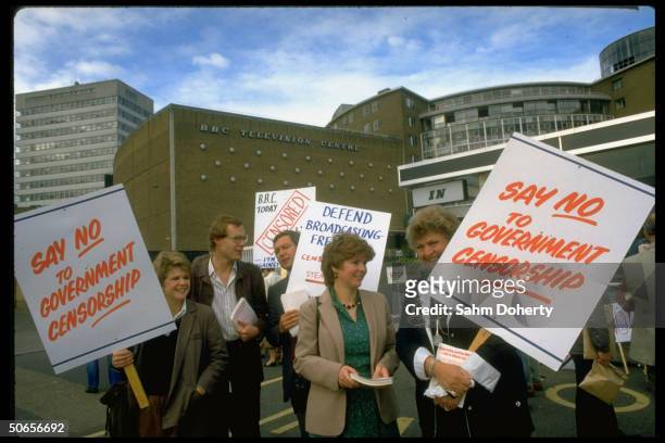 Demonstrators from the British Broadcasting Corporation and Independent Television News waving signs outside during media strike, re banned...