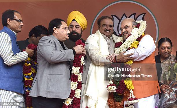 Union Ministers Ananth Kumar, J. P. Nadda, and Chief Minister of Madhya Pradesh Shivraj Singh Chouhan greet to BJP leader Amit Shah after he was...