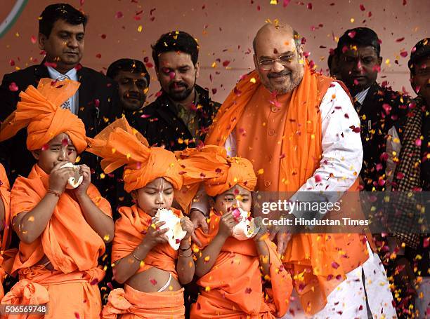 Children greet to BJP leader Amit Shah after he was re-elected as Party President at BJP HQ on January 24, 2016 in New Delhi, India. Shah was elected...