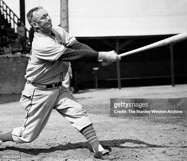 Gabby Hartnett, catcher of the Chicago Cubs, hits a home run, circa 1939.