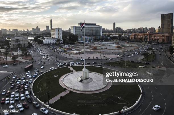 An Egyptian national flag flutters over Cairo's Tahrir Square on January 24 on the eve of the anniversary of the 2011 uprising. - On January 25...