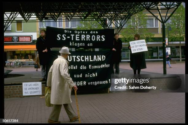 Demonstrators w. Signs at Jewish protest in remembrance of Holocaust, against Pres. Ronald Reagan's visit to Bitburg cemetery outside CDU HQ