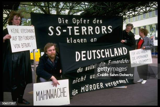 Demonstrators w. Signs at Jewish protest in remembrance of Holocaust, against Pres. Ronald Reagan's visit to Bitburg cemetery outside CDU HQ